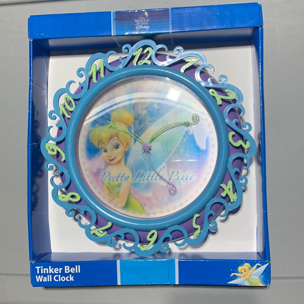 New in original box. TinkerBell Pretty Little clock